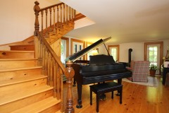Grand-Oak-Staircase-by-Ian-Blakney-and-Bobs-Grand-Piano-and-Yotul-Fireplace-8DEC19